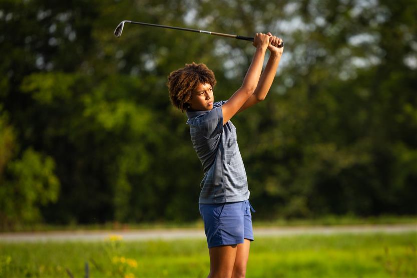 Students play golf
